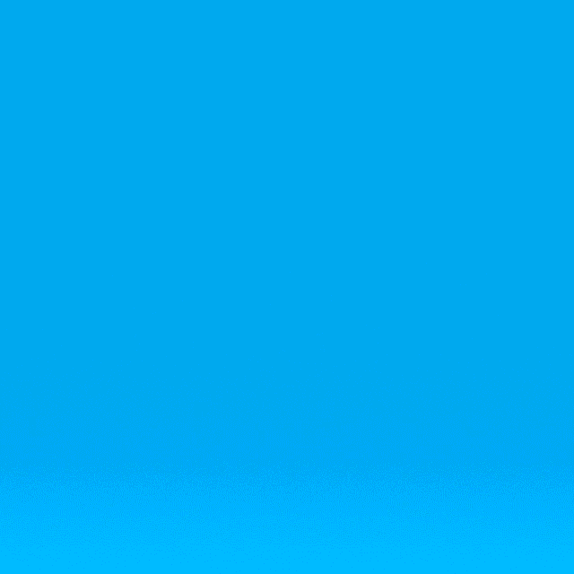 Digital art gif. A bubble-like heart with iridescent pink, purple, and blue hues spins upward against a blue backdrop.